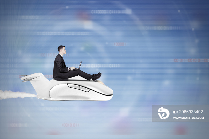 Businessman flying with computer mouse