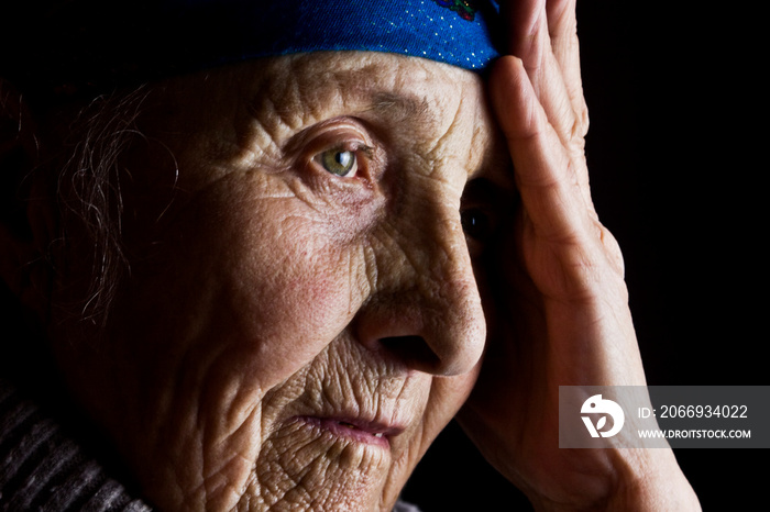 Grandma’s sad face. Wrinkles of an old mother. Grandmother close-up. Old face of an old grandmother