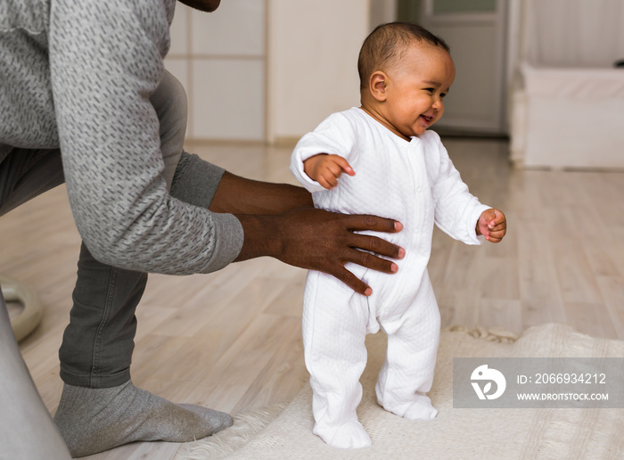 African American Father Playing With mixed race Baby Son