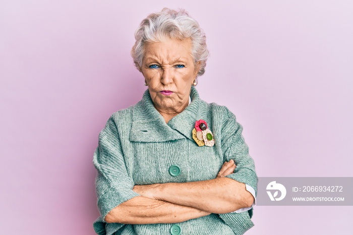 Senior grey-haired woman wearing casual clothes depressed and worry for distress, crying angry and afraid. sad expression.