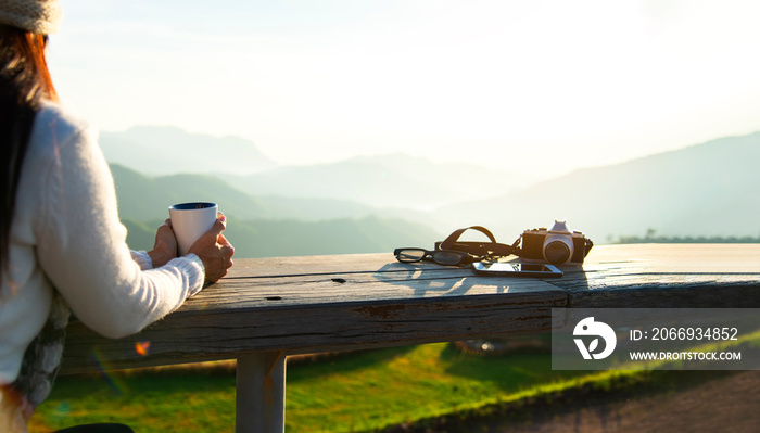 Woman drinking coffee in sun sitting outdoor in sunshine light enjoying her morning coffee, vintage. Lifestyle Concept