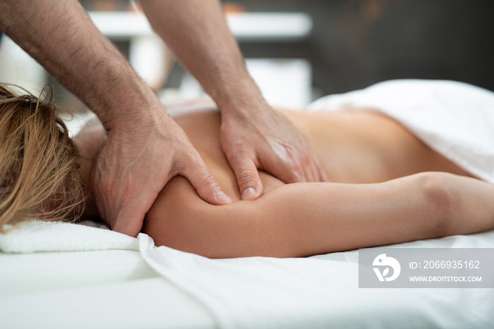 I feel relaxed. Close up of therapist hands treating middle aged woman with spa procedure