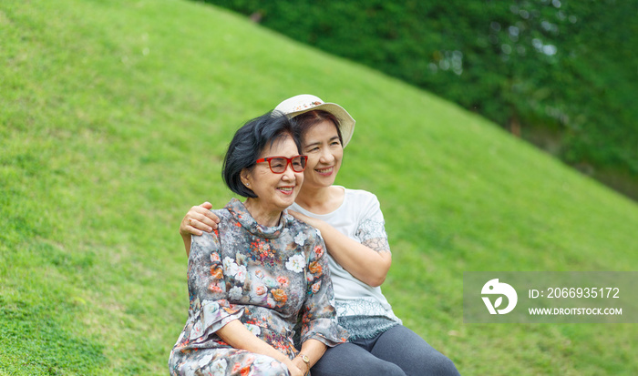 Senior asian woman with daughter relaxing on vacation together in mothers day.