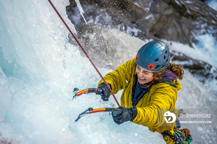 Climber scales vertical ice in Ouray, Colorado