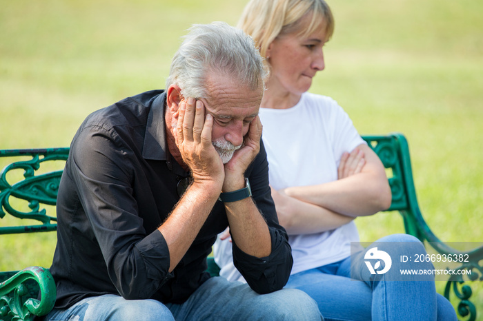 senior couple having problems in relationship  at park together in morning time. old people Argument . Elderly resting .mature relationships. family