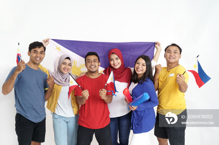 excited asian young supporter holding philippine flag over white background