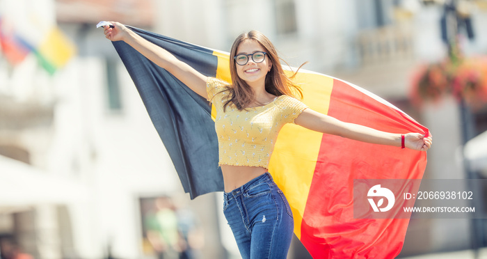 Attractive happy young girl with the Belgian flag