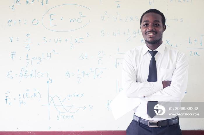 African teacher teaching  science in the classroom.