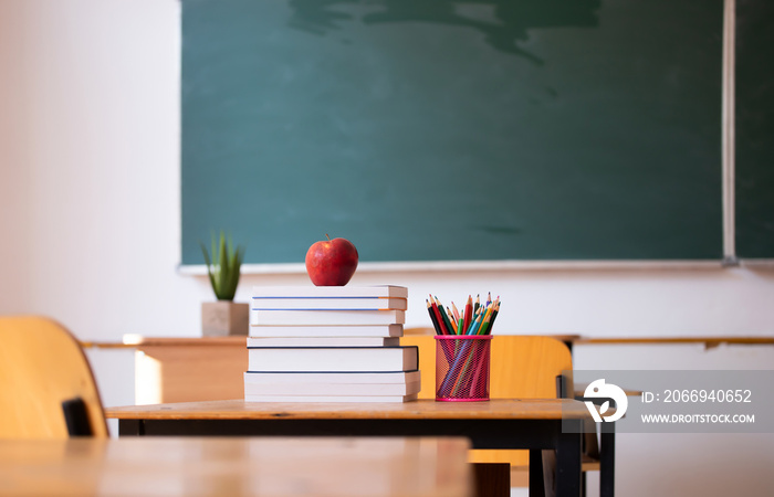 Pencils and books in the classroom. Education concept.