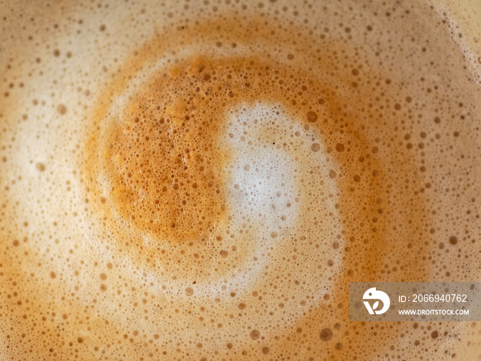 Cappuccino milk foam spiral closeup