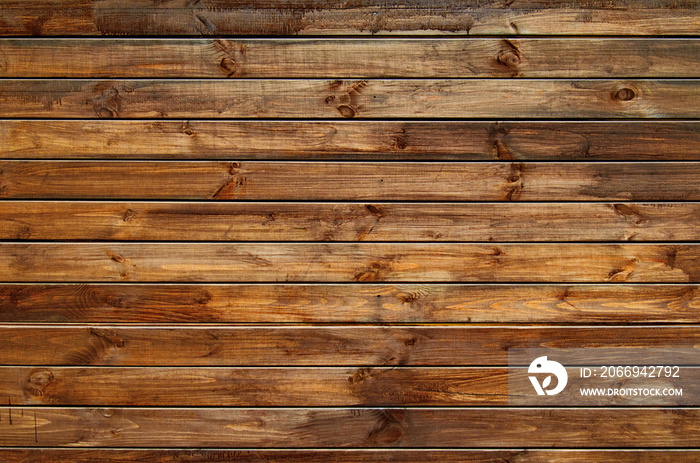 Background of natural knotted wood fence. Wooden texture.