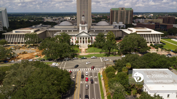 Flags Blow Atop Traffic Below The Capital Dome in Tallahassee Florida