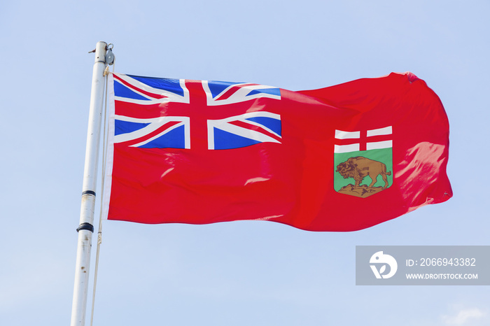 Manitoba flag against blue sky