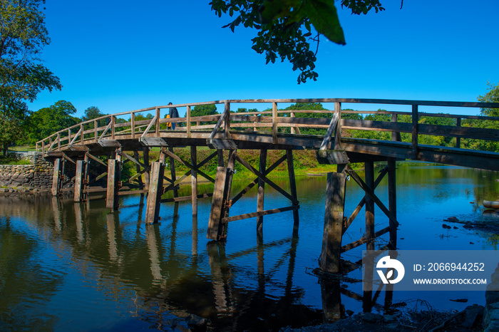 Old North Bridge and Memorial obelisk in Minute Man National Historical Park, Concord, Massachusetts MA, USA.