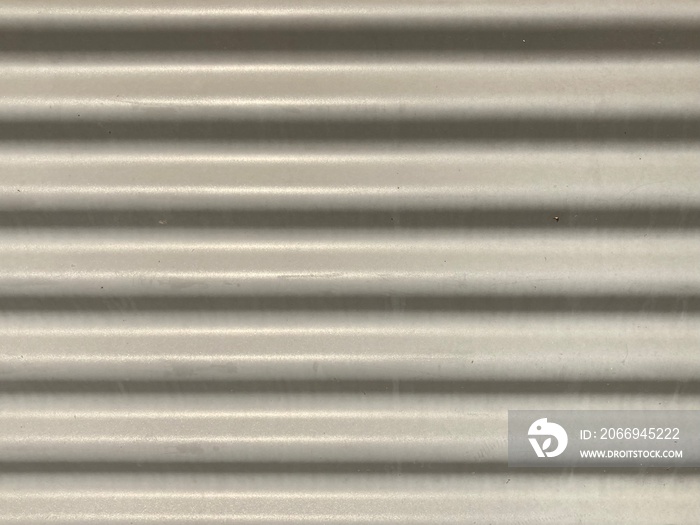 Gray corrugated metal as background