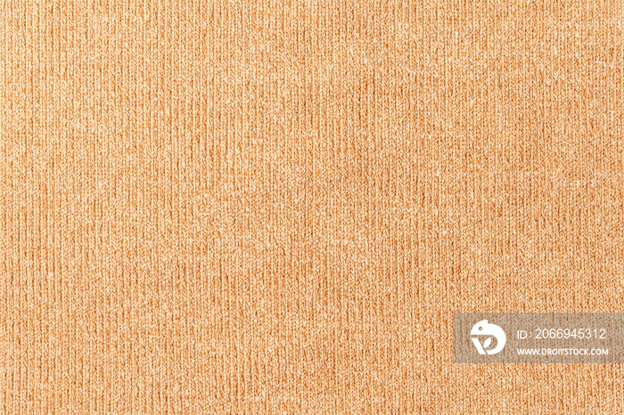 abstract background of beige knit fabric texture close up