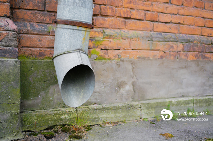 pipe for draining rainwater on the wall of a house