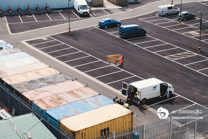 Port workers resting next to the van at the Port of Ramsgate on sunny day