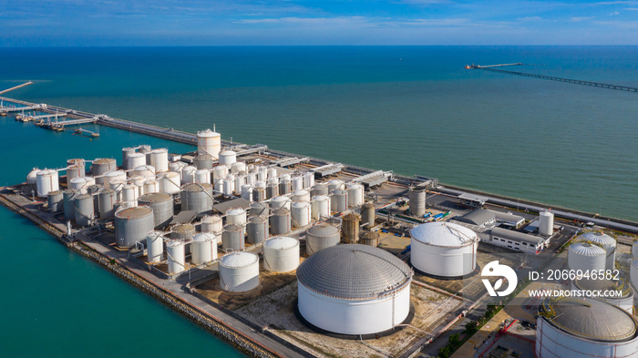 Aerial view of tank terminal with lots of oil storage tank and petrochemical storage tank in the harbour, Industrial tank storage aerial view.