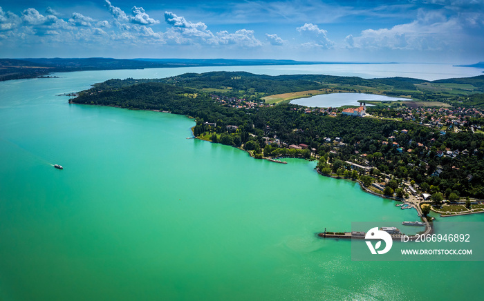 Tihany, Hungary - Aerial panoramic view of Lake Balaton with the Benedictine Monastery (Tihany Abbey, Tihanyi Apatsag) on top of the hill. This view includes the harbor of Tihany, the Inner lake