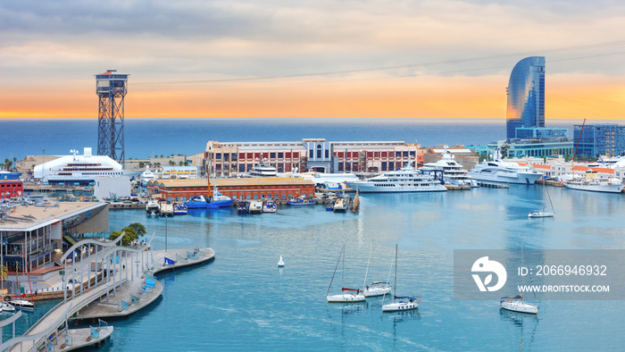 Barcelona cruise port, public promenade and cable car over Barceloneta at sunset