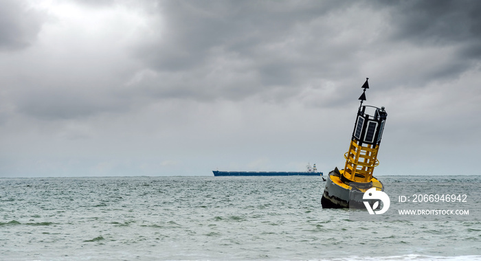 cardinal buoy stranded on the beach