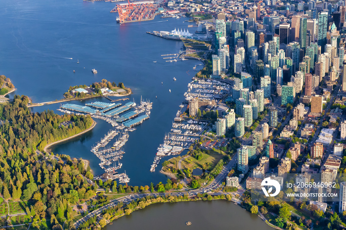 Aerial view of Coal Harbour and a modern Downtown City during a vibrant sunny morning. Taken in Vancouver, British Columbia, Canada.