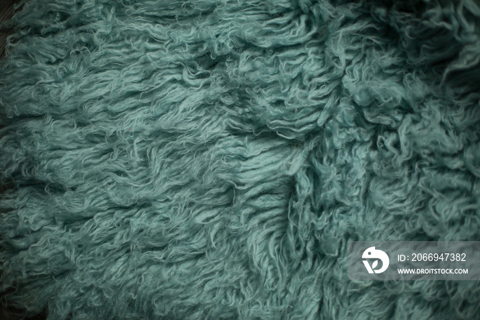 flokati. sheepskin fur. green fur. natural wool