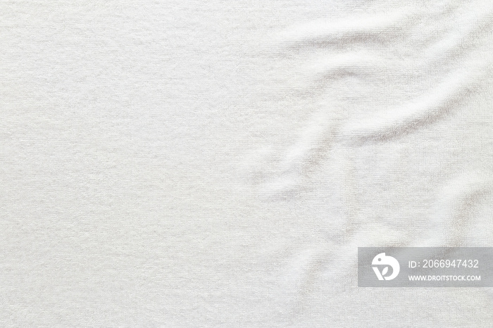 White towel texture for background. That fabric or textile consist of cotton fiber material. Look plush, fluffy, dry, soft and clean. For background about baby, spa, hotel, laundry and hygiene etc.