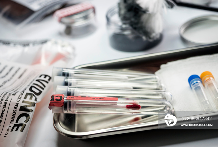 Detail of DNA sampling tubes in Laboratorio forensic equipment, conceptual image