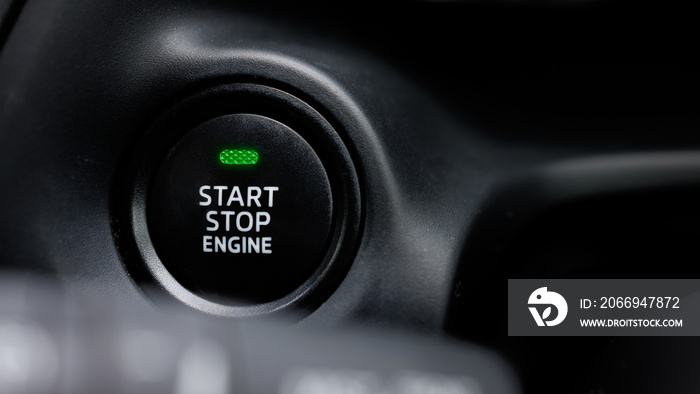 The engine start and stop button for modern car engine ignition. Keyless technology concept.