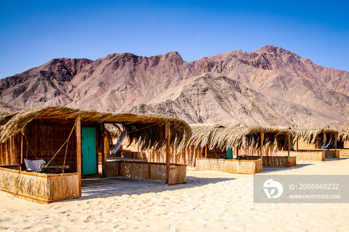 Simple bungalow style shacks at a desert beach resort in Nuweiba on the Red Sea coast of Egypt’s Sinai Peninsula