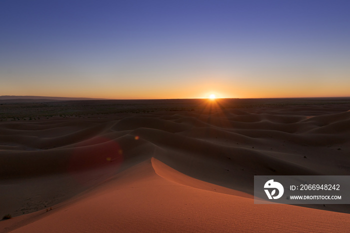 Huge desert dunes of Erg Chigaga, at the gates of the Sahara, at sunset. Morocco. Concept of travel and adventure.