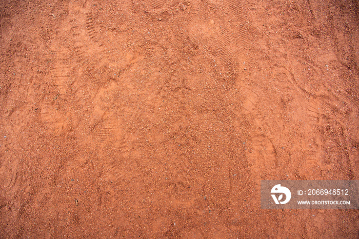 Red sand texture with shoe prints on top