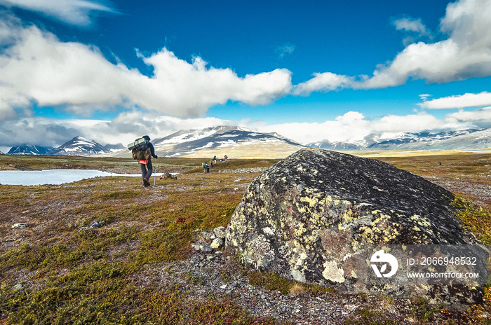 Thyrists in the mountains. People in camping equipment. Sweden, Lapland, Sarek National Park