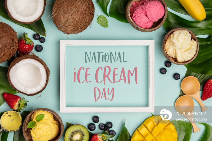 National ice cream day 19 july concept. Tropical fruits and plants with variety of ice cream in coconut shells on blue background