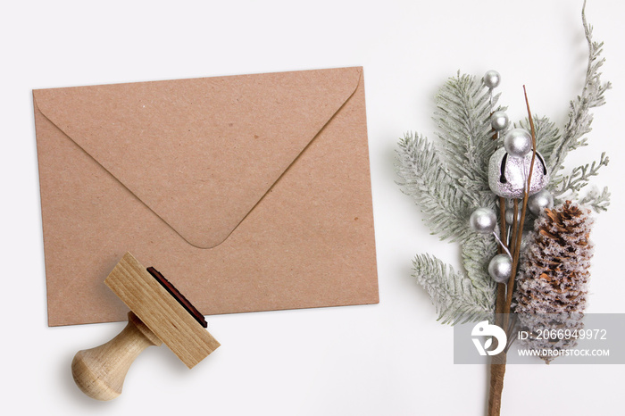 Christmas, Xmas rubber stamp and kraft envelope. Mockup for winter holiday products