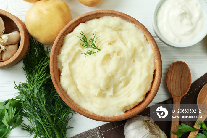 Concept of tasty eating with mashed potatoes on white wooden table