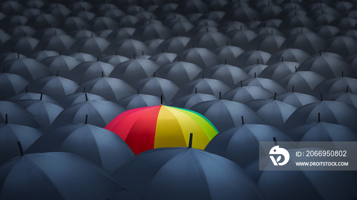 businessman with colorful rainbow umbrella among others, unique different concept