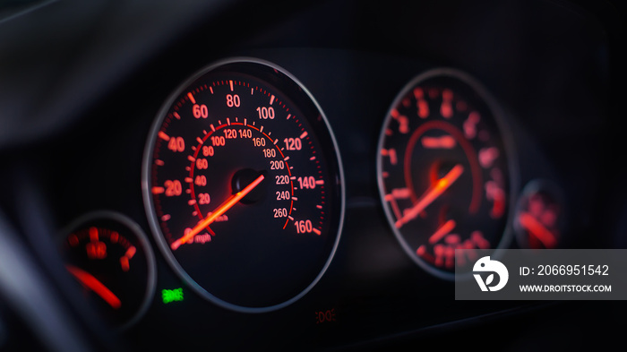 Modern car dashboard with RPM and Miles Per Hour Speedometer Close Up.