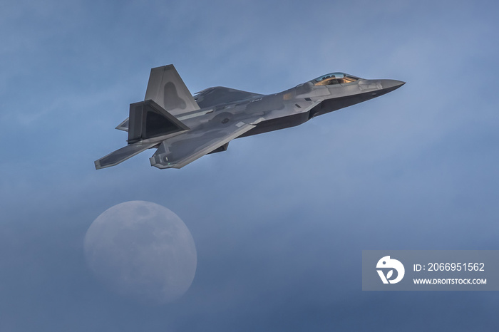 F-22 Raptor Armed Fighter Jet on a combat mission. F22 Raptor jet fighter warplane flying in front of the moon armed with sidewinders and missiles. Chinese spy balloon interceptor