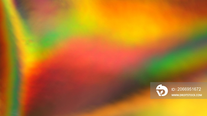 Holographic green, orange, yellow, gold gradient. Abstract background