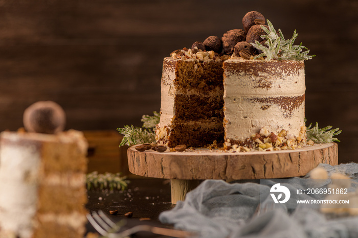 Slice of delicious naked coffee and hazelnuts cake