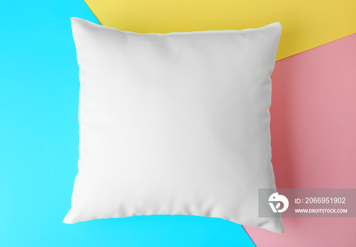 Blank pillow on color paper background