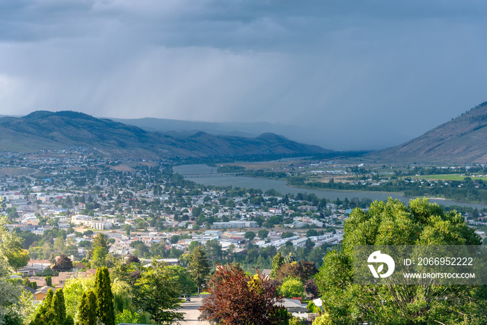 Dramatic Stormy Clouds over a Mountain Town on a Summer Day. Kamloops, BC, Canada.