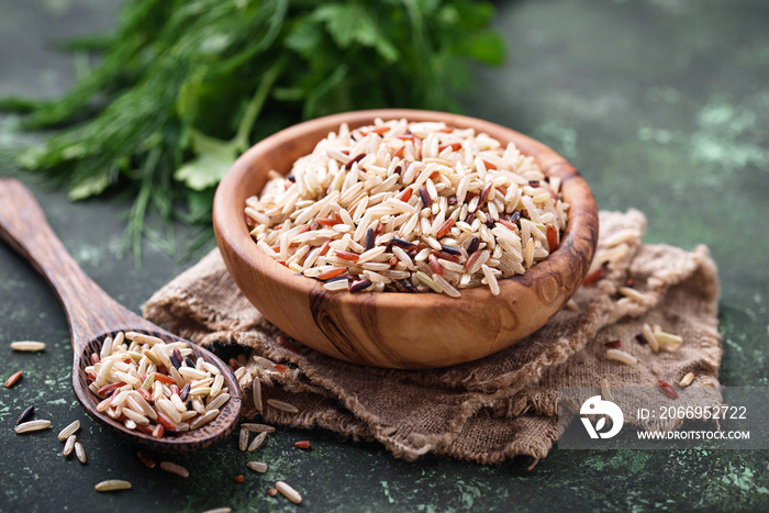 Mix of brown, red and wild rice in bowl