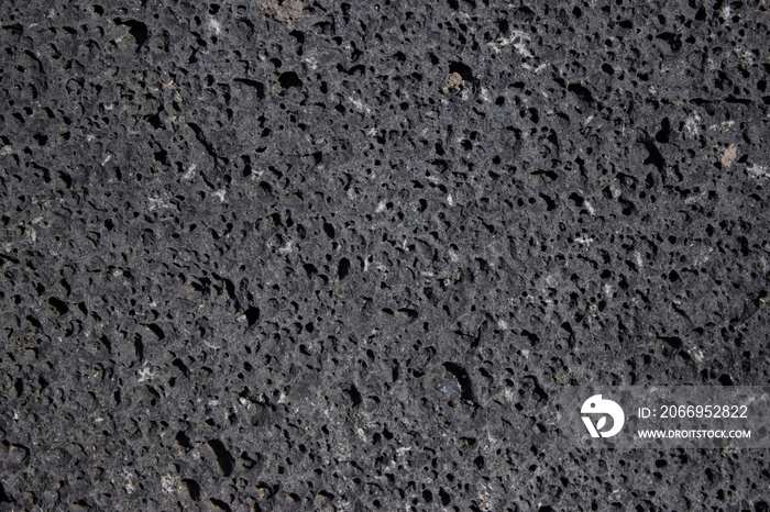 basalt wall, volcanic rock, stone with holes