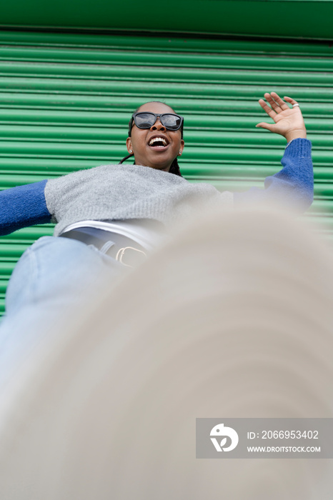 Young stylish woman doing kicking motion