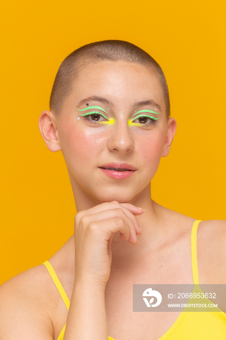 Studio portrait of girl with neon colored make-up