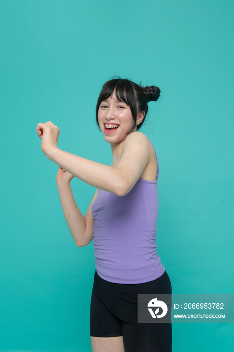 Studio portrait of smiling girl gesturing